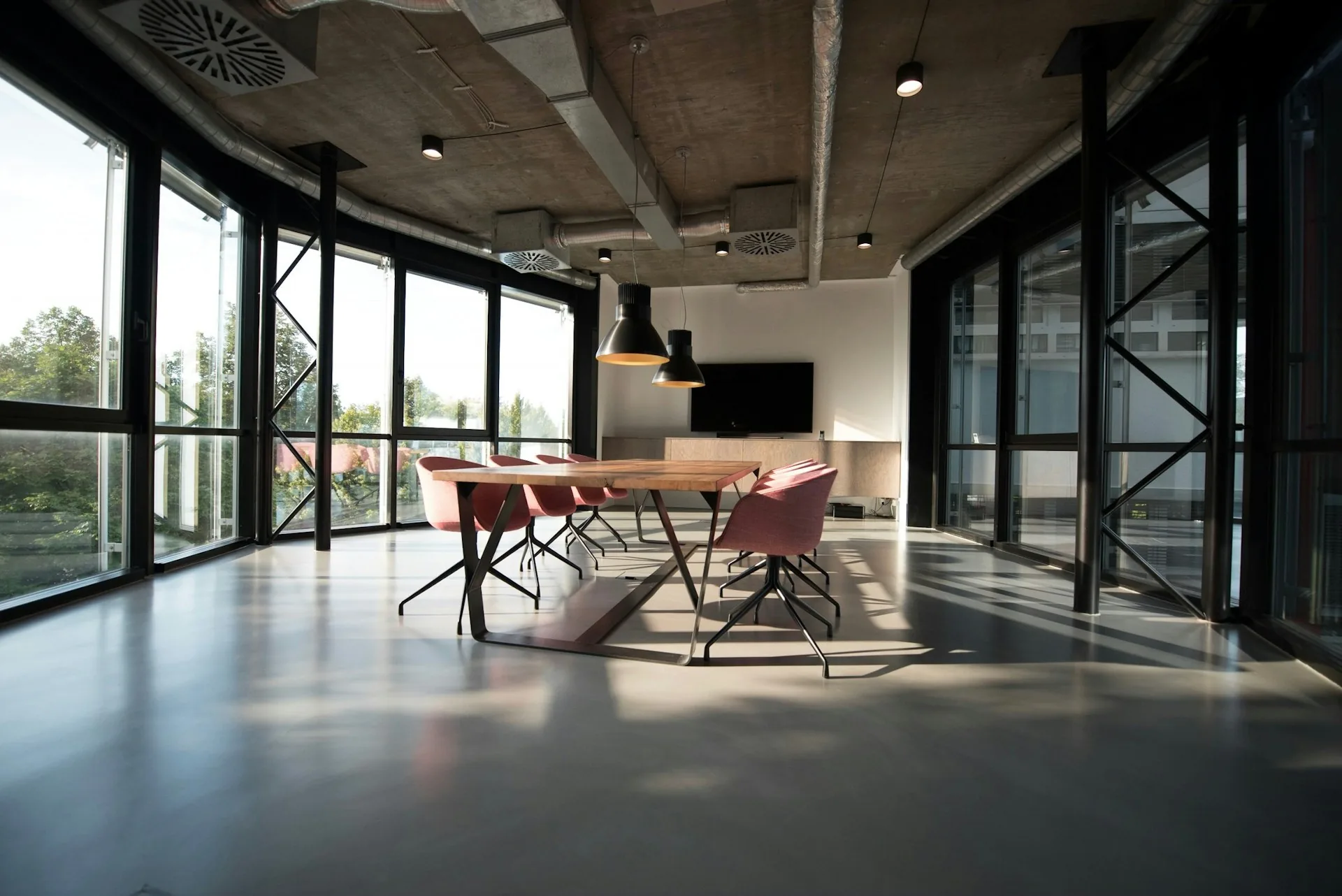 Minimal modern office interior with desks and large windows
